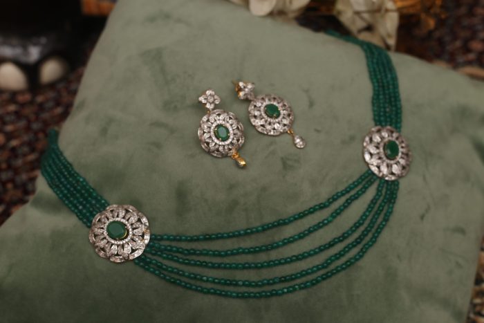 Emerald strings with matching earrings and two pendants