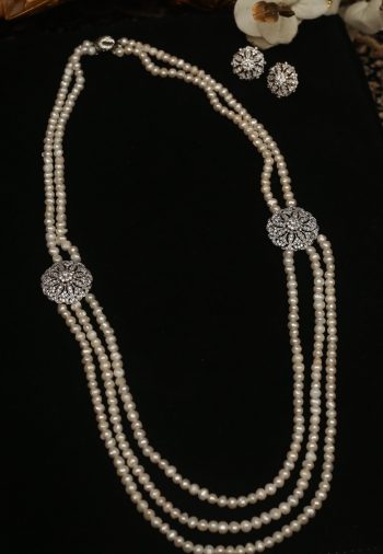 Pearl string with diamond pendant and matching earrings