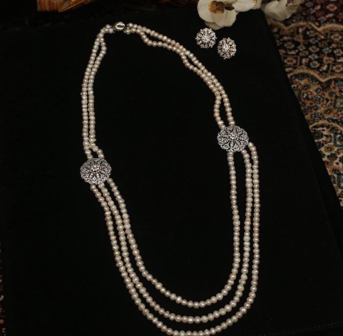 Pearl string with diamond pendant and matching earrings