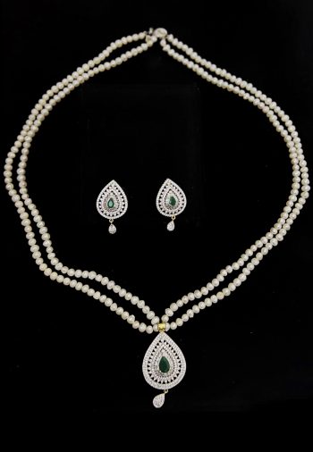 2 layer real pearl strings with diamond and emerald pendant and matching earrings