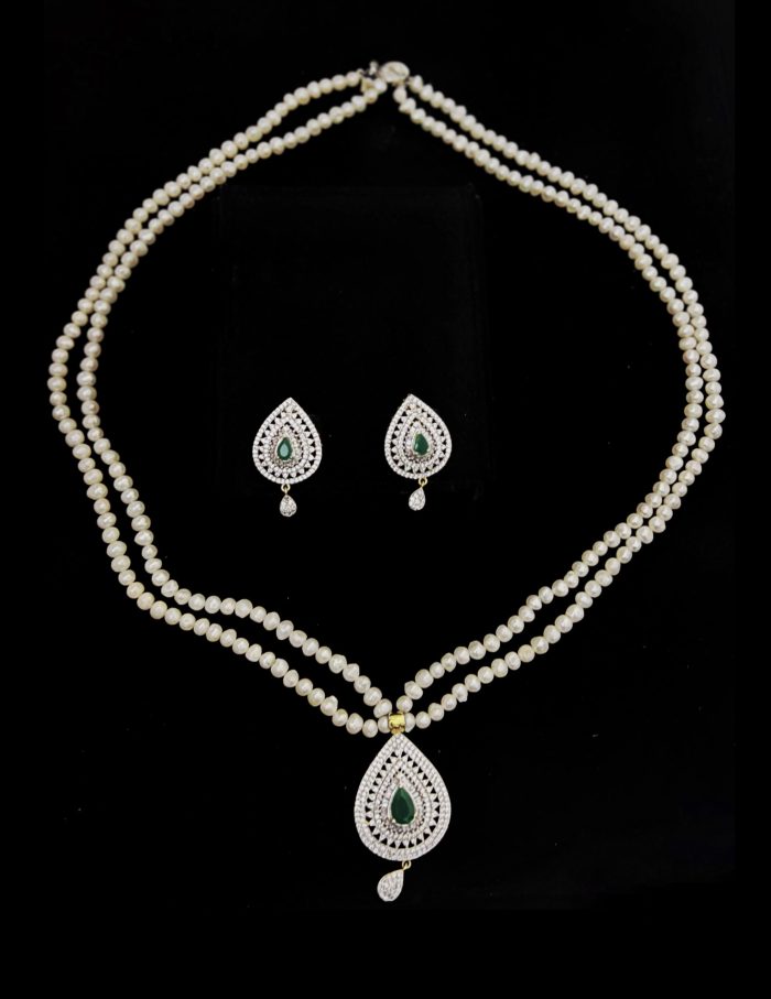 2 layer real pearl strings with diamond and emerald pendant and matching earrings